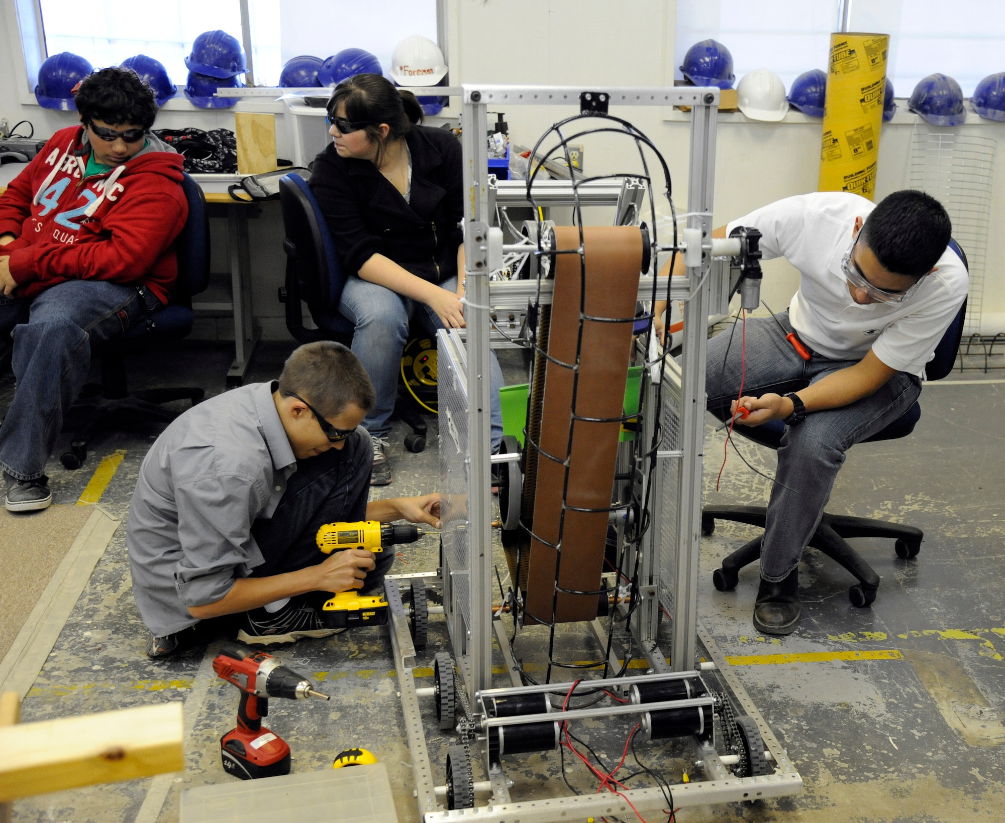 LAUGHLIN AIR FORCE BASE, Texas – Members of the Del Rio High School robotics team prepare the robot’s frame for mounting onboard electronics at the school’s engineering shop Feb. 14. For six weeks, the students planned and developed the robot to compete in the Rebound Rumble competition in San Antonio. (U.S. Air Force photo/Airman 1st Class Nathan L. Maysonet)