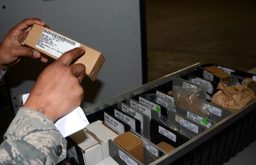 Airman 1st Class Antonio Harris inspects the serial number of a filter element during an inventory check Joint Base Charleston – Air Base Feb. 8. The MRSP section manages MRSPs or kits which are air transportable packages of repair parts and related maintenance supplies required to sustain a C-17 Globemaster III aircraft for a specified period of planned wartime or contingency operations. Harris is a 628th Logistics Readiness Squadron MRSP section apprentice. (U.S. Air Force Photo/Senior Airman Anthony Hyatt)