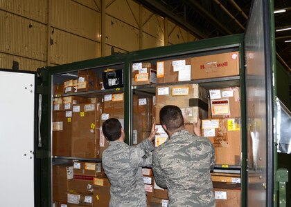 Senior Airman Chase Hoyt and Airman 1st Class William McQuillan conduct an inventory of a Mobility Readiness Spares Package Feb. 8 at Joint Base Charleston - Air Base. MRSPs are air transportable packages of repair parts and related maintenance supplies required to sustain a C-17 Globemaster III aircraft for a specified period of planned wartime or contingency operations. Hoyt and McQuillan are from the 628th Logistics Readiness Squadron MRSP section. (U.S. Air Force Photo/Senior Airman Anthony Hyatt)