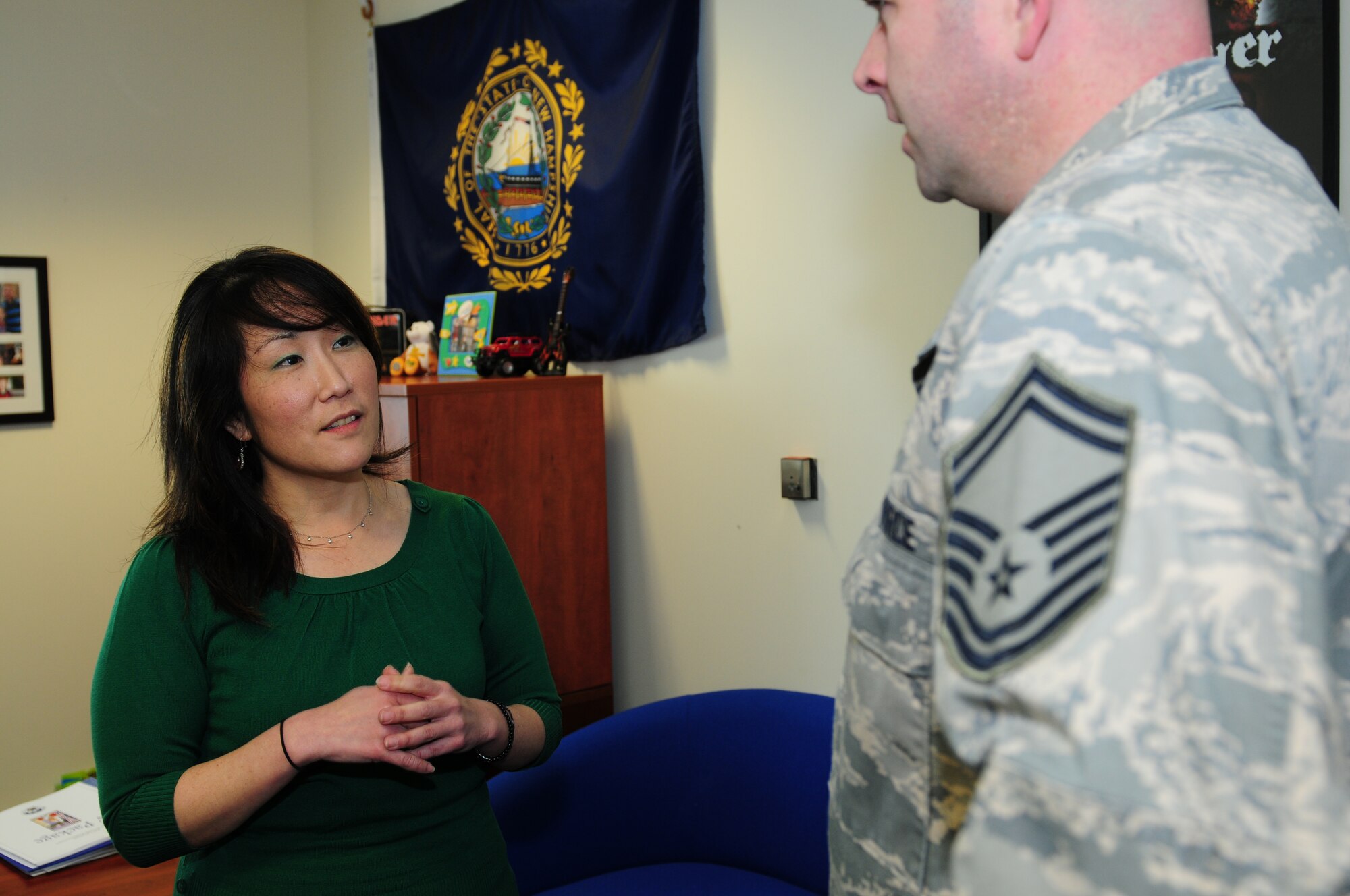 ROYAL AIR FORCE LAKENHEATH, England -- Robyn Endo, 48th Force Support Squadron chief of Airman & Family Readiness Center, helps a customer, Feb. 6, 2012. Endo was nominated for a Liberty Spotlight because she displays the core value of 'Service Before Self'. (U.S. Air Force photo by Airman 1st Class Cory D. Payne) 
