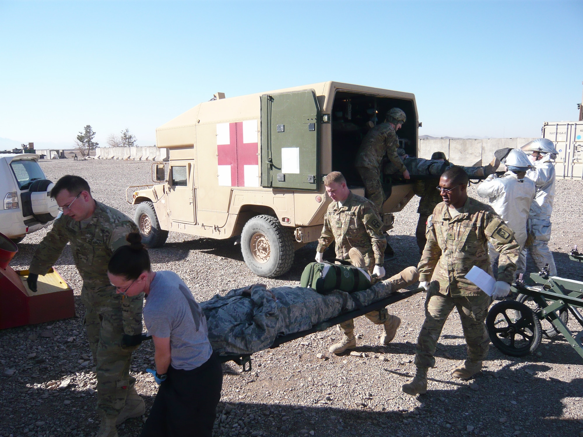 Emergency responder transport a simulated victim during an aircraft mishap response exercise at Shindand Air Base Feb. 12, 2012. (Courtesy photo)