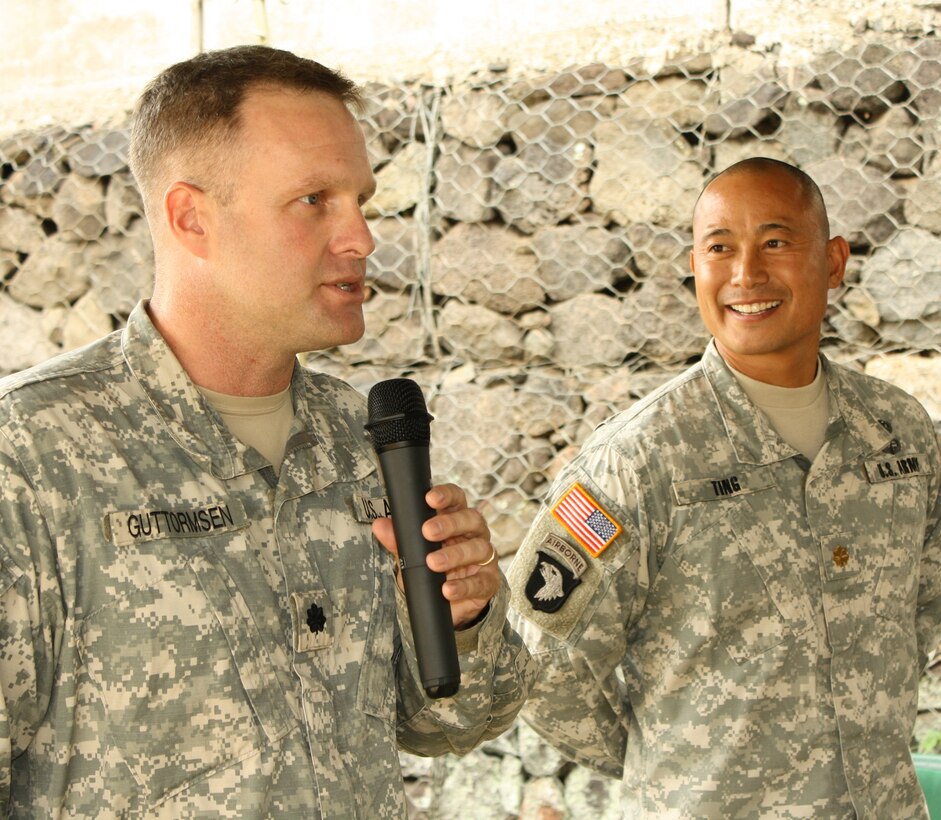 Honolulu District commander Lt. Col. Douglas Guttormsen, left, presents the de Fleury Medal to Maj. Evan Ting during the end of year Pa-ina on Friday, October 7, 2011.