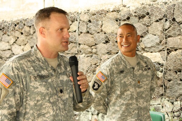 Honolulu District commander Lt. Col. Douglas Guttormsen presents the de Fleury Medal to Maj. Evan Ting during the end of year Pa-ina on Friday, October 7, 2011.