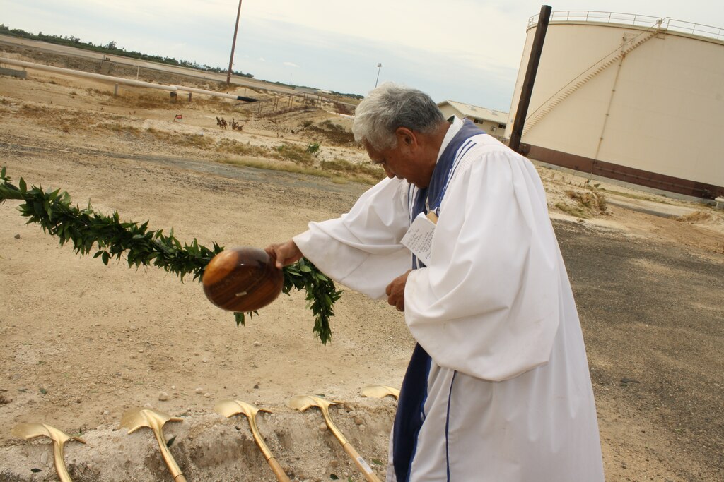 Reverend David Ka`upu conducts the traditional untying of the maile lei and ground breaking ceremony for the FY11 Alter Fuel Storage Tanks project at Area 11, Joint Base Pearl Harbor-Hickam (JBPHH).  
