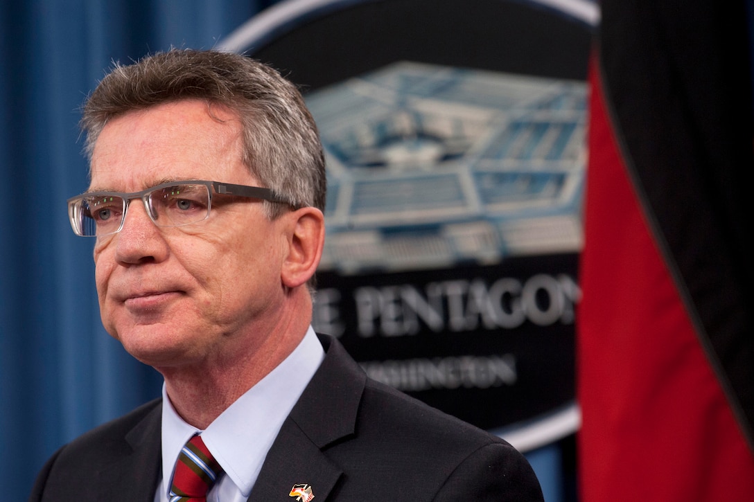 German Defense Minister Thomas de Maiziere listens to a media question during a press conference with U.S. Defense Secretary Leon E. Panetta at the Pentagon, Feb. 16, 2012.