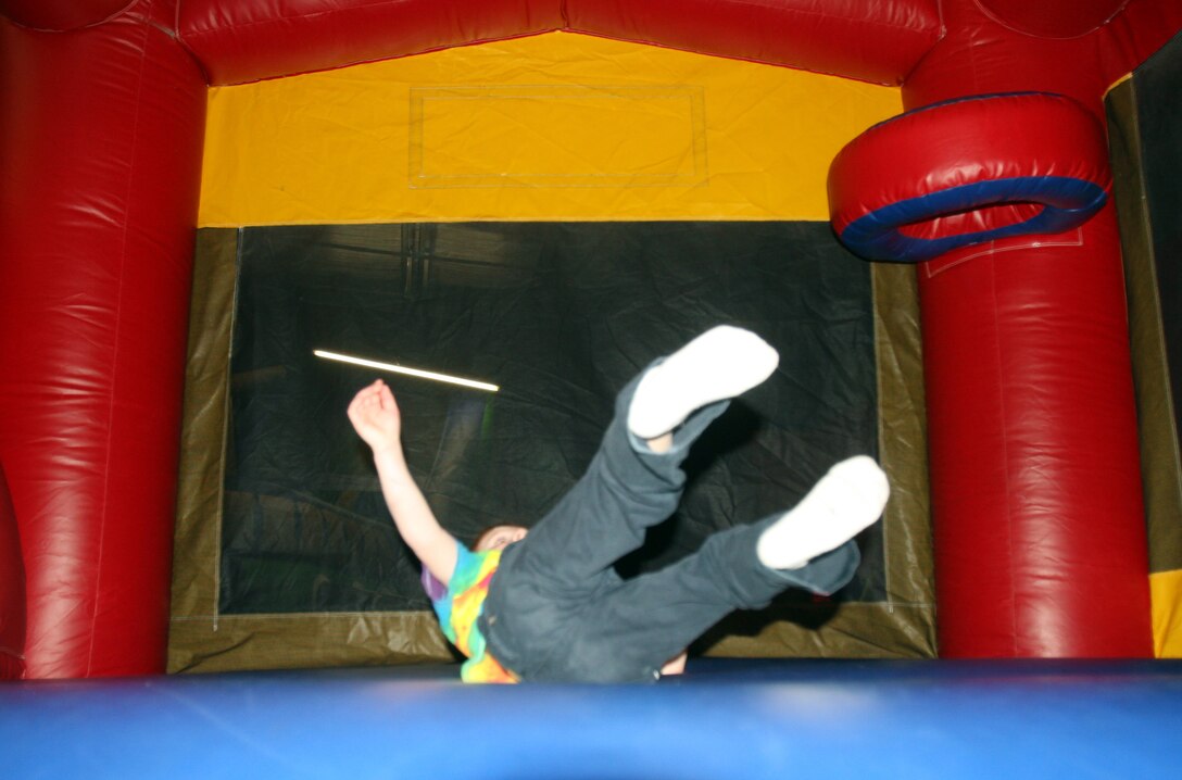 A child plays in a bouncy house during a Jump-N-Jax Pot Luck held for Marines with Combat Logistics Regiment 27, 2nd Marine Logistics Group at a local business in the Jacksonville, N.C., Feb. 13, 2012. Throughout the 2nd MLG’s year-long deployment, the regiment gave spouses the opportunity to bring their children to a safe environment to have fun while they relax, eat food and converse with other parents from the unit. The next CLR-27 Jump-N-Jax Pot Luck is scheduled for March 12.  For more information on family readiness activities contact the regiment’s FRO, Jose Padilla, at 451-1284 or by email at jose.l.padilla@usmc.mil.  (U.S. Marine Corps photo by Pfc. Franklin E. Mercado)