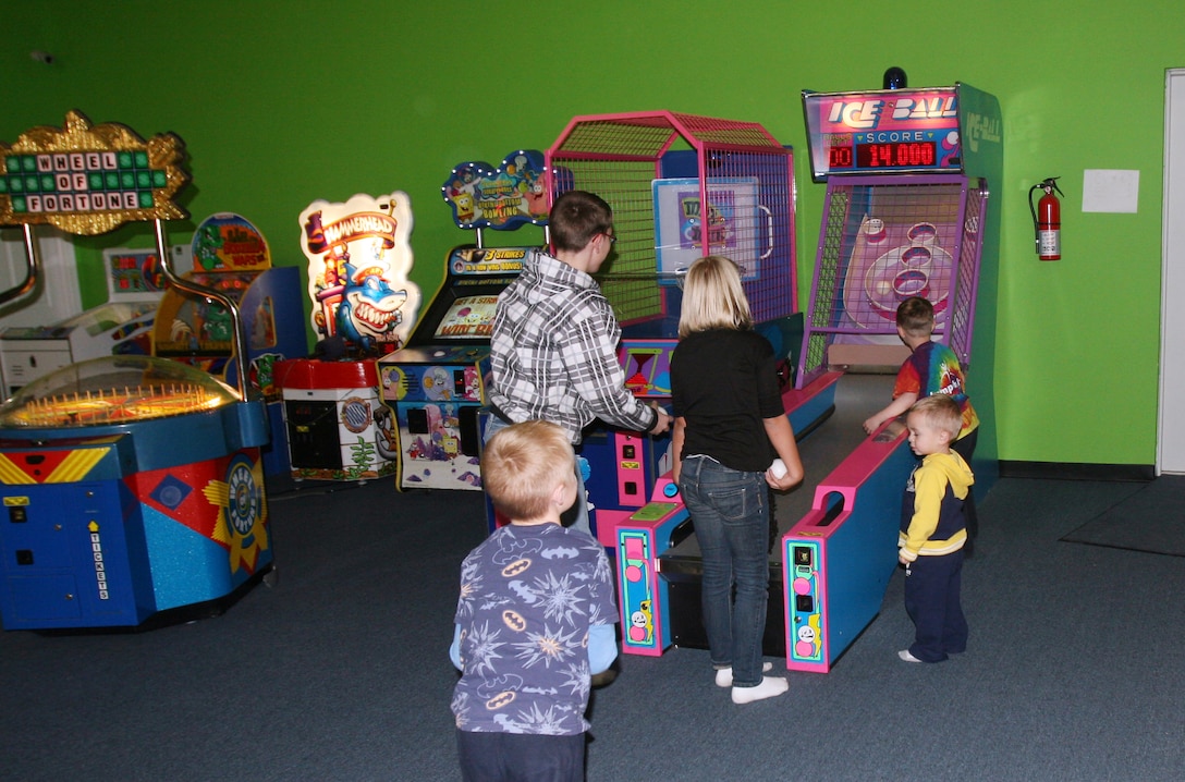 Children play games on an arcade machine during a Jump-N-Jax Pot Luck held for Marines with Combat Logistics Regiment 27, 2nd Marine Logistics Group at a local business in the Jacksonville, N.C., Feb. 13, 2012. Throughout the 2nd MLG’s year-long deployment, the regiment gave spouses the opportunity to bring their children to a safe environment to have fun while they relax, eat food and converse with other parents from the unit. The next CLR-27 Jump-N-Jax Pot Luck is scheduled for March 12.  For more information on family readiness activities contact the regiment’s FRO, Jose Padilla, at 451-1284 or by email at jose.l.padilla@usmc.mil.  (U.S. Marine Corps photo by Pfc. Franklin E. Mercado)