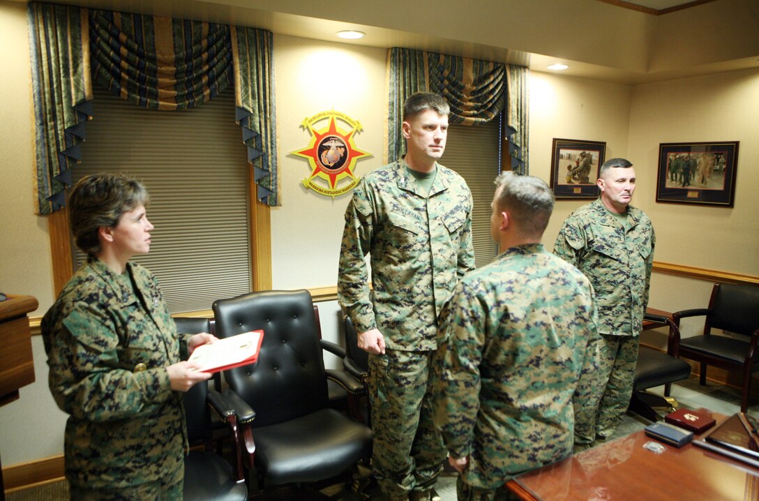 Petty Officer 1st Class Raymond R. Price, a corpsman with the Group Aid Station, 2nd Marine Logistics Group, stands at attention during a ceremony at the 2nd MLG headquarters building aboard Camp Lejeune, N.C., Jan. 20, 2012. During the ceremony Price received the 2011 2nd MLG Senior Sailor of the Year award for his outstanding achievements and performance during the past year. (U.S. Marine Corps photo by Pfc. Franklin E. Mercado)