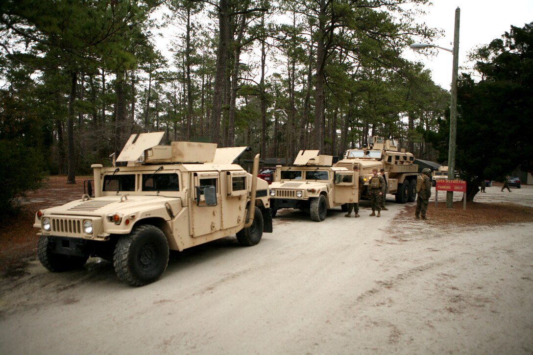 Marines and sailors with 8th Engineer Support Battalion, 2nd Marine Logistics Group stage vehicles prior to departing for a convoy exercise as part of the Convoy Leaders Course aboard Camp Lejeune, N.C., Jan. 11, 2012.  The Battle Skills Training School offers this training exercise in order to prepare units for upcoming deployments.  The class helps train Marines and sailors to be effective in convoy operations overseas where this knowledge can mean the difference between a successful and unsuccessful mission.