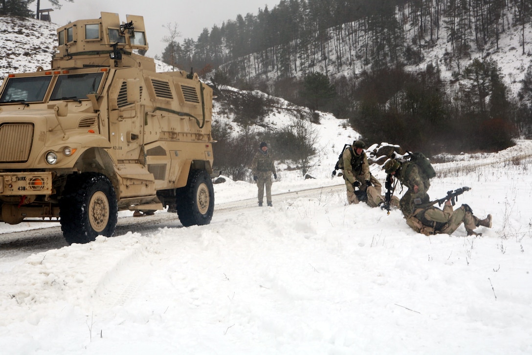 Georgian soldiers evacuate their wounded buddies from Scout Platoon, Delta Co., 23rd Light Infantry Battalion after the platoon engaged in a firefight with enemy insurgents while on a reconnaissance mission for a mission rehearsal exercise at Joint Multinational Readiness Center, Hohenfels, Germany, Feb. 17. The MRE is the culminating event for the Republic of Georgia's 23rd Light Infantry Battalion prior to deploying to Afghanistan to conduct counterinsurgency operations in support of the Georgia Deployment Program - International Security Assistance Force (GDP-ISAF). The total training exercise runs Feb. 1 - 24.