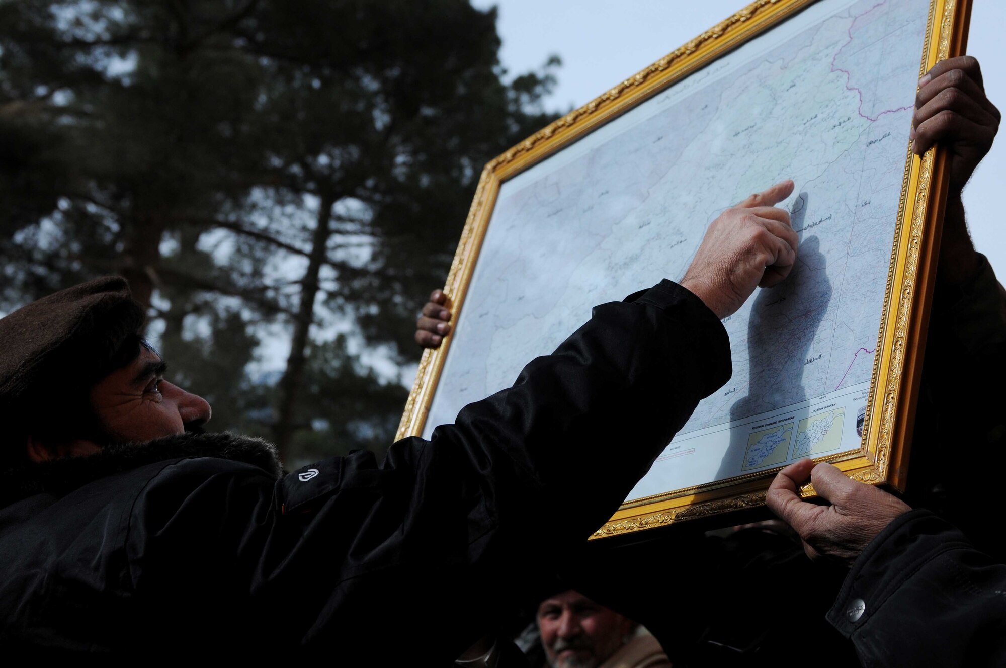 Abdul Rahman Mangal, Paktya Province deputy governor, identifies Chamkani District on a map, during a government outreach mission in Paktya Province, Feb 1. The deputy governor presented a district map to Said Mohammad, Chamkani sub-governor, during a ribbon-cutting ceremony for the newly remodeled Chamkani district center. (U.S. Air Force photo by 1st Lt Cammie Quinn, PRT Paktya public affairs office)