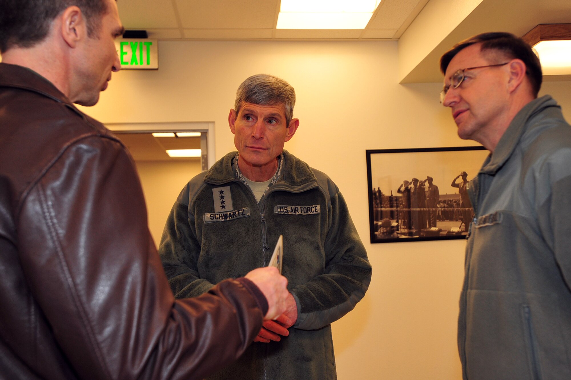 Air Force Chief of Staff Gen. Norton Schwartz speaks to Col. Bryan Radliff, 477th Fighter Group commander and Lt. Gen. Stephen Hoog, 11th Air Force commander, Feb. 16, 2012, at Joint Base Elmendorf-Richardson, Alaska. Schwartz talked about his vision for the Air Force and answered questions from Airmen. (U.S. Air Force photo/Staff Sgt. Sheila deVera)