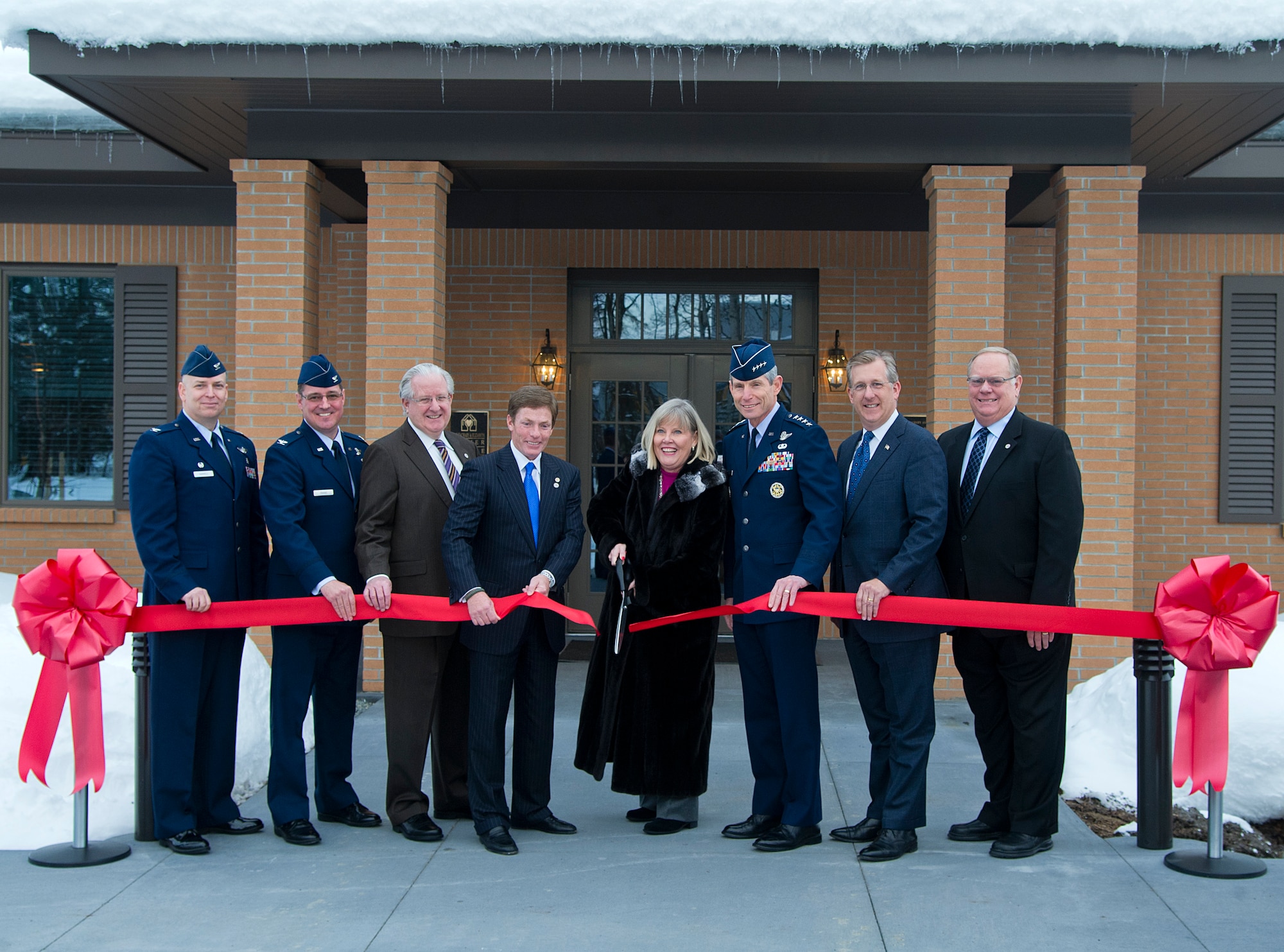 Air Force Chief of Staff Gen. Norton Schwartz and his wife Suzie cut the ribbon on the new Alaska Fisher House with key leaders at Joint Base Elmendorf-Richardson, Feb. 17, 2012.  The Fisher House on JBER is already hosting a family and is the first Fisher House built in Alaska. (U.S. Air Force photo/Staff Sgt. Zachary Wolf)