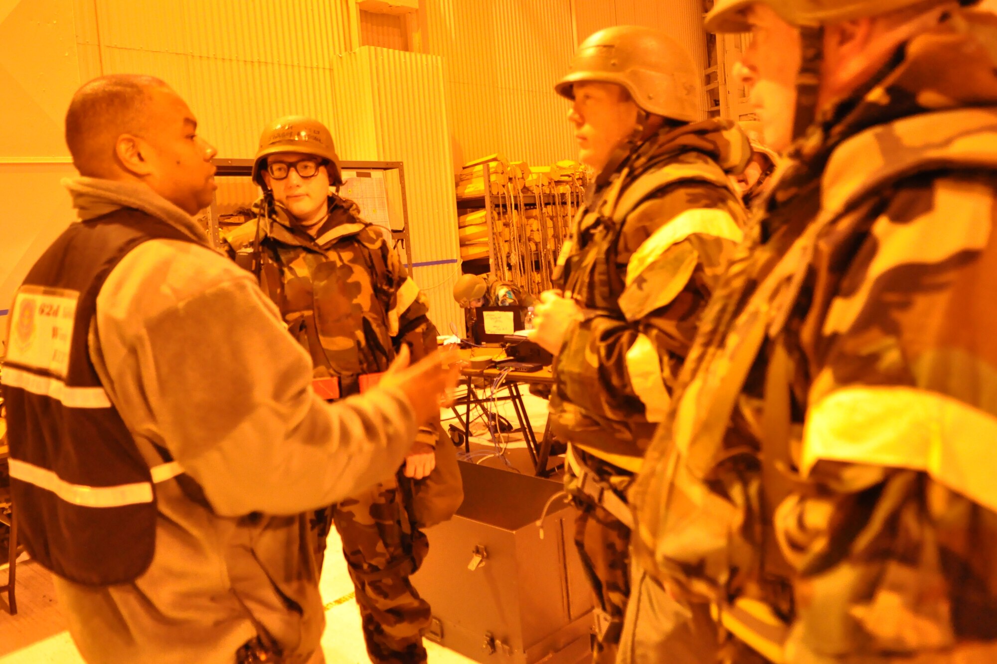 Airmen assigned to the 62nd Aerial Port Squadron receive feedback from an exercise evaluation team member during a mobility exercise Feb. 17, 2012, at Joint Base Lewis-McChord, Wash. “The main goal of this week’s exercise is to provide an overall training opportunity,” said Capt. Brian Dodson, 62nd Airlift Wing deputy chief of exercises and evaluations. (U.S. Air Force photo/Airman 1st Class Leah Young)