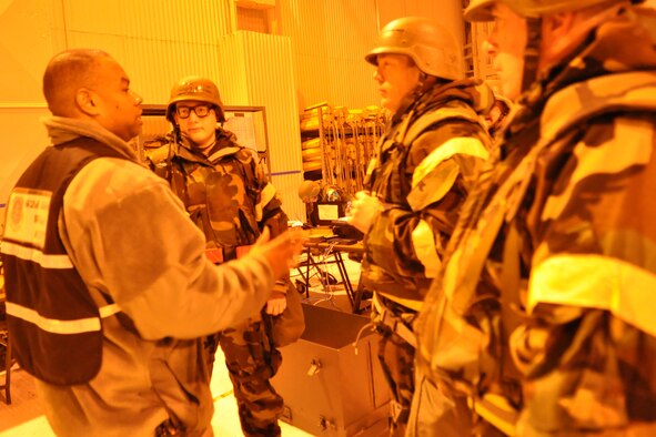 Airmen assigned to the 62nd Aerial Port Squadron receive feedback from an exercise evaluation team member during a mobility exercise Feb. 17, 2012, at Joint Base Lewis-McChord, Wash. (U.S. Air Force photo/Airman 1st Class Leah Young) 