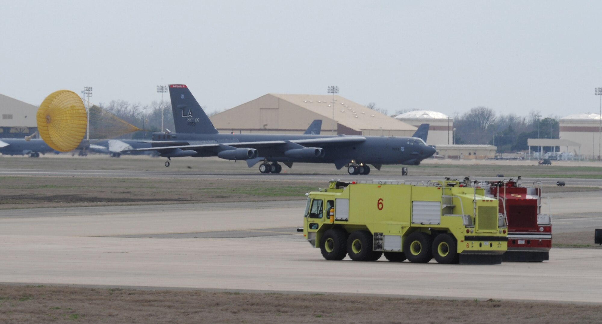 A B-52H Stratofortress makes an emergency landing on Barksdale Air Force Base, La., Feb. 16. Emergency landings may occur due to brakes overheating, birds striking the aircraft, engine problems or other mechanical or medical issues. Firefighters are placed on standby to ensure rapid response should an emergency occur. (U.S. Air Force photo/Airman 1st Class Micaiah Anthony)(RELEASED)
