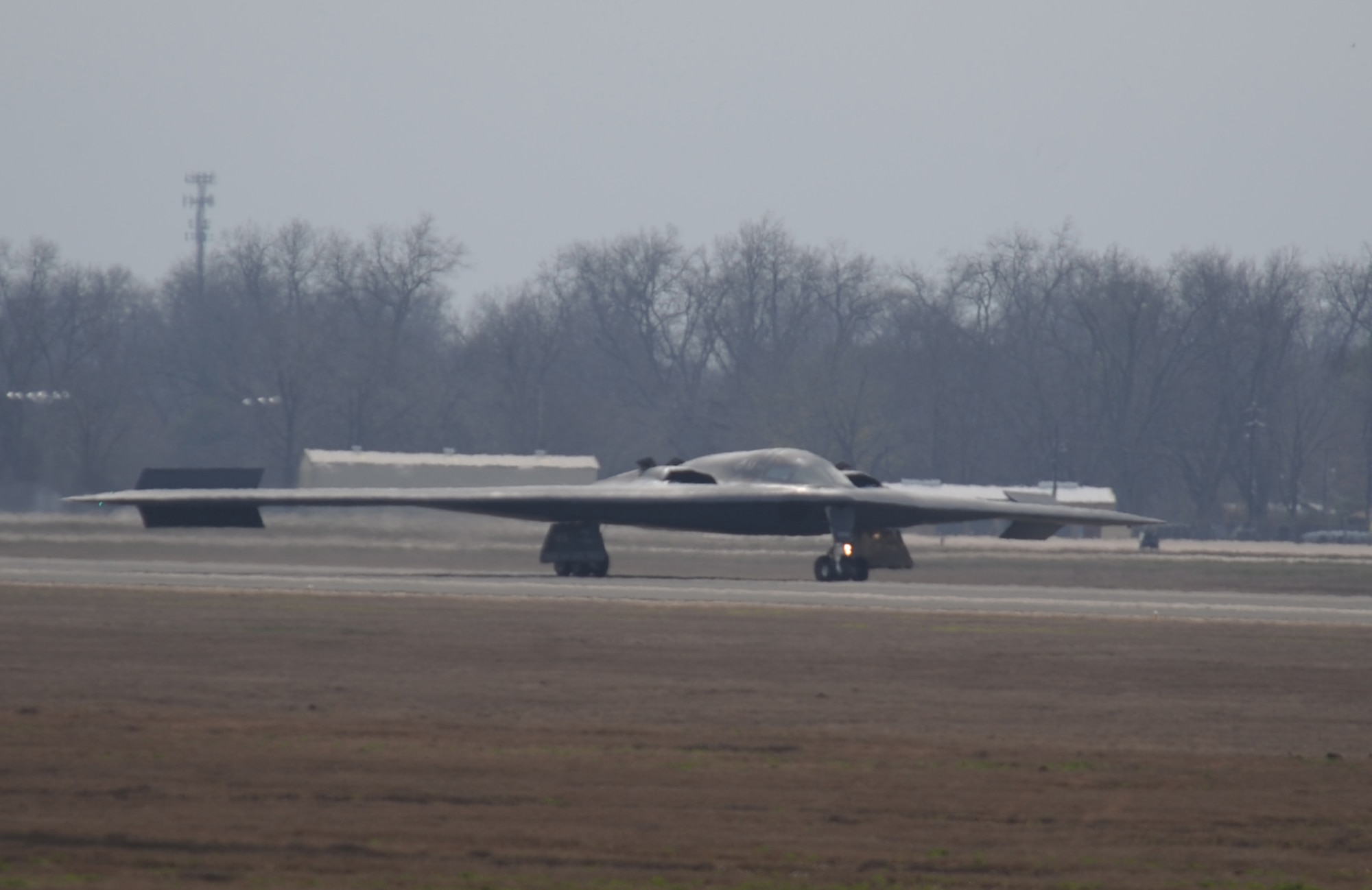 A B-2 Spirit stealth bomber lands on Barksdale Air Force Base, La., Feb. 16. The B-2 is classified as a heavy bomber and is capable of delivering 40,000 pounds of conventional and nuclear munitions to its target. (U.S. Air Force photo/Airman 1st Class Micaiah Anthony)(RELEASED) 

