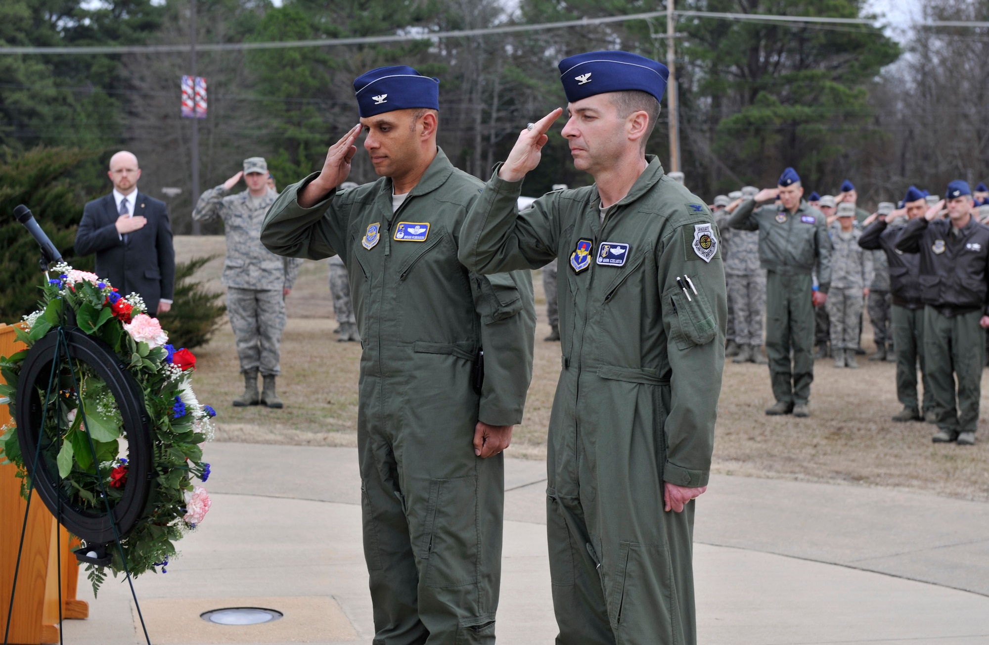 Col. Brian Robinson, 19 Airlift Wing commander, Col. Mark Czelusta, 314th Airlift Wing commander, and Team Little Rock salute during a ceremony at Heritage Park, Feb. 17, 2012, at Little Rock Air Force Base, Ark.  The ceremony honored Sgt. William D. Blair, Capt. Edward R. Breen, 1st Lt. Maurice F. Cherry, Tech. Sgt. Raymond L. Hughes, and 1st Lt. Henry M. Thorsen, who died while performing a flight training mission Feb. 18, 1972. (U.S. Air Force photo by Senior Airman Caleb Pierce)