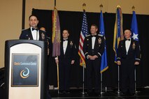 Lt. Col. Jay Sabia, 4th Fighter Squadron commander, acknowledges the 4 FS achievement upon receiving the 388th Fighter Wing Squadron of the Year honors. Master Sgt. Kristopher Kiger holds the guidon for the 4 FS after the honorary stream was added to it. USA photo by Alex Lloyd.