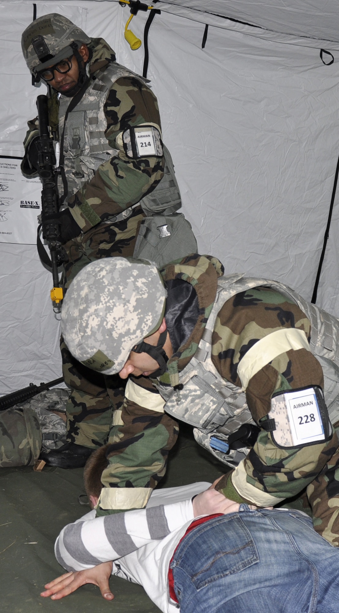Master Sgt. Carlos Duell (with weapon), 446th Security Forces Squadron Phoenix Raven Program manager, provides cover while a security forces Airman secures a hostile during an operational readiness exercise at Joint Base Lewis-McChord, Main, Feb. 15, 2012. Duell, who's been with the 446th Airlift Wing since 1989, has been on missions which have taken him to more than 80 countries. He plans to participate in more Raven missions in March. (U.S. Air Force photo/Master Sgt. Jake Chappelle)