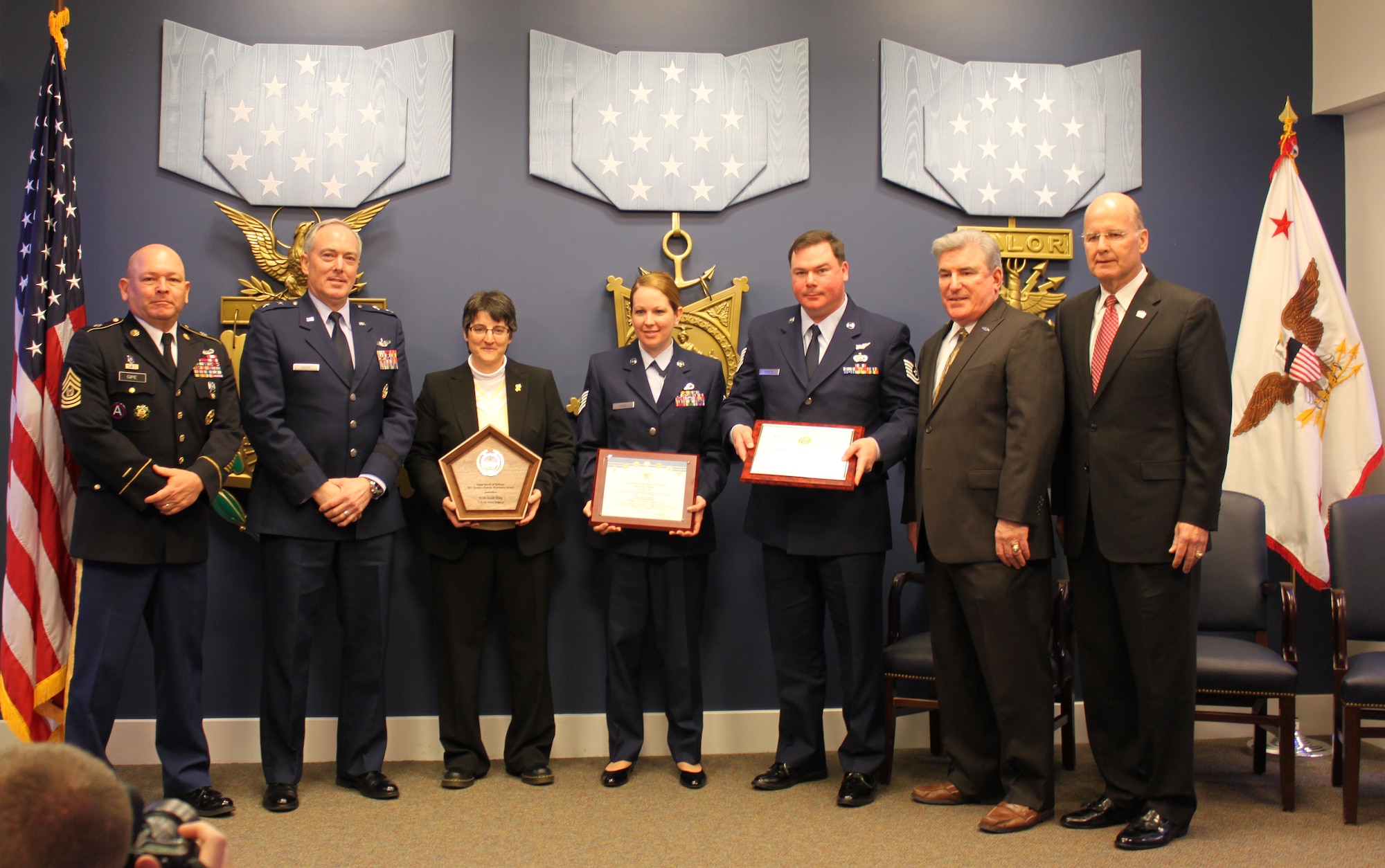 The Office of the Assistant Secretary of Defense for Reserve Affairs recognized the 512th Airlift Wing Airman and Family Readiness office Feb. 17, 2012, during a cermony at the Hall of Heroes inside the Pentagon. The Dover Air Force Base, Del., Reserve unit was selected as the best U.S. Air Force Reserve program in the Department of Defense. Holding the awards from left to right are 512th AF& R members Laura Coseglia, Tech. Sgt. Mariah Krass and Tech. Sgt. Ivan Kobetz. (U.S. Air Force photo/Tech. Sgt. Christin Michaud)