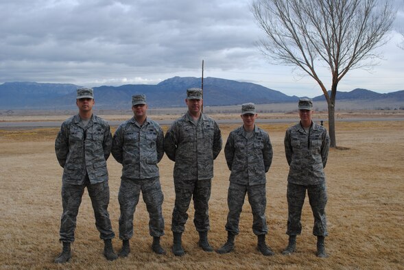 KIRTLAND AFB, N.M. – Seven Airmen from the 898th Munitions Squadron put their emergency response skills to the test when they witnessed a car crash Feb. 7 near Amarillo, Texas. They are from left to right, Airman 1st Class Carl Krejci, Senior Airman Ryan Dearth, Tech. Sgt. Shawn Piel, Airman 1st Class Nathaniel Iverson and Airman 1st Class Anne Price. Not pictured are Staff Sgt. David Henke and Airman 1st Class Marshall Bowland. (Photo by Stefan Bocchino)