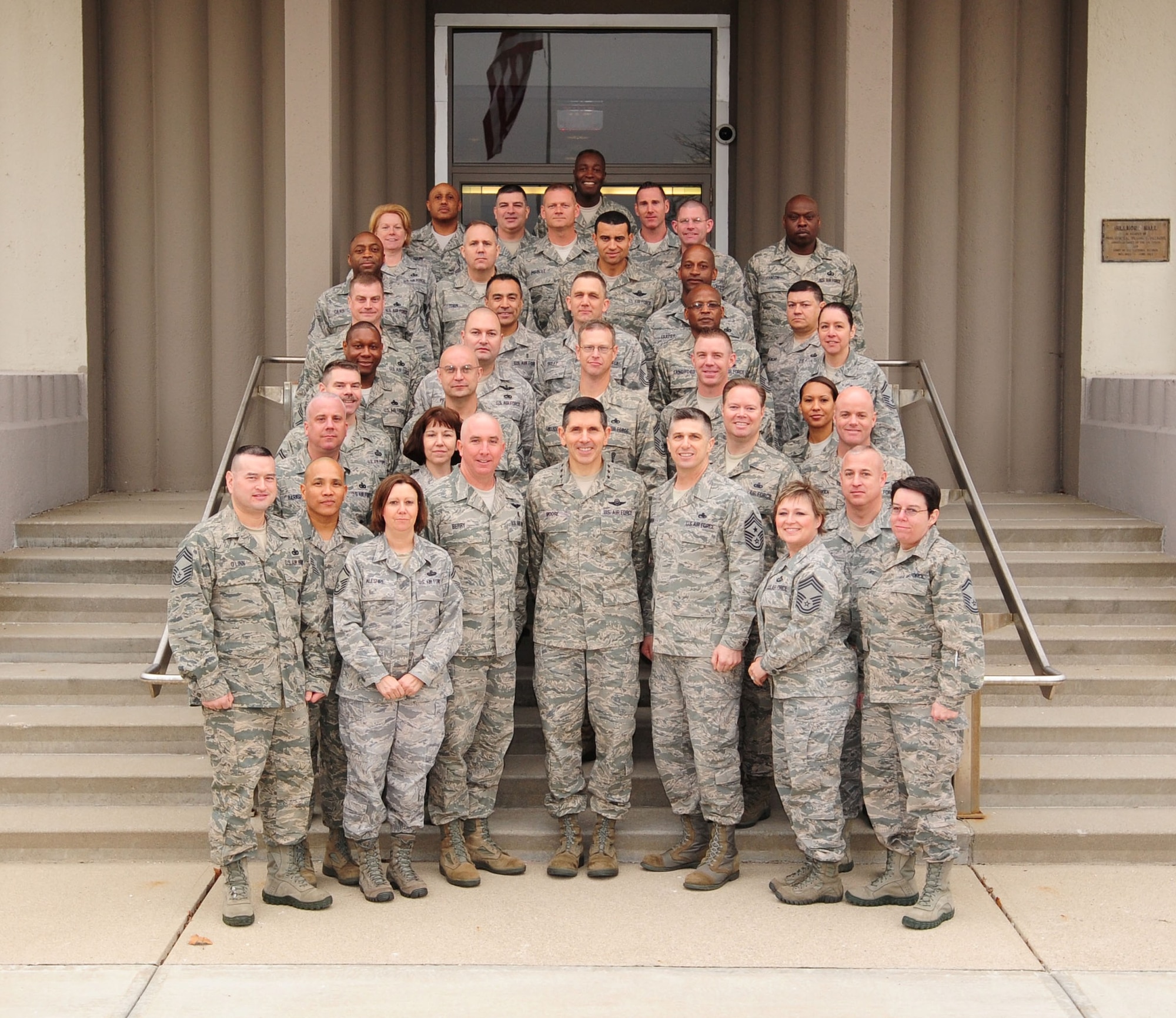 Air Force Materiel Command's newest chief master sergeants pose with Lt. Gen. C.D. Moore II, AFMC vice commander (front center), Chief Master Sgt. Eric Jaren, AFMC command chief (to Moore's left), and Chief Master Sgt. Joel Berry, class mentor (to Moore's right), at the 2012 AFMC Chiefs' Orientation. (U.S. Air Force photo/Airman First Class James Jacobs)