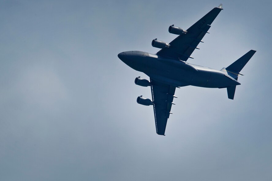 CHANGI, SINGAPORE -- A U.S. Air Force C-17 Globemaster III from the Pacific Air Forces (PACAF) Demonstration Team performs an aerial display during the 2012 Singapore Airshow on Feb. 15. The PACAF C-17 demo team is part of the 535th Airlift Squadron and is based out of Joint Base Pearl Harbor-Hickam, Hawaii. (Department of Defense photo by U.S. Air Force Tech. Sgt. Michael R. Holzworth/Released)