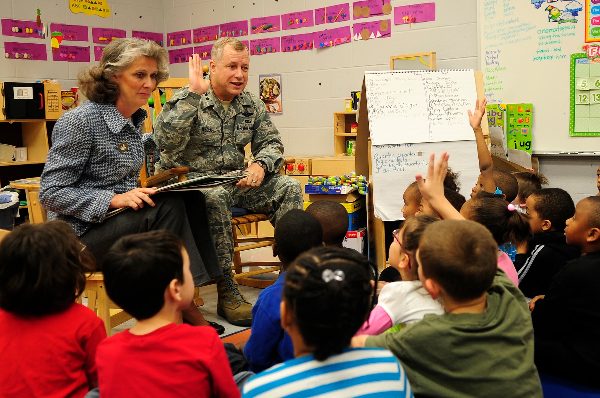 U.S. Air Force Maj. Gen. Lawrence Wells, 9th Air Force commander, asks local children to raise their hands for questions with his wife, Kathy Wells, at Oakland Primary School in Sumter, S.C., Feb. 17, 2012. Wells and his wife spent the morning with the kindergarten students reading and discussing lessons from each book. (U.S. Air Force photo by Airman 1st Class Hunter Brady/Released)