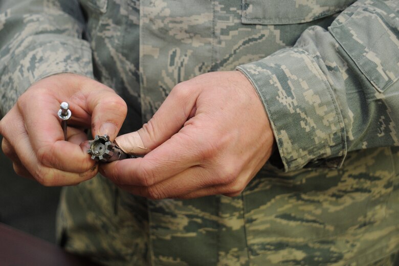 Air Force Senior Airman Josh Buckenberger, 910th Combat Arms Training Maintenence Combat arms instructor, demonstrates weapons safety and familiarization at Youngstown Air Reserve Station, Feb. 5, 2012. Sergeant Buckenberger led the class as part of mandatory Operations Readiness Inspection training. U.S. Air Force photo by Airman 1st Class Ron Dombkowski