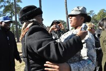 Senior Airman Nyeisha J. Harrington, 916th Security Forces Squadron, is welcomed back to Seymour Johnson by friends and family on Feb. 12, 2012, after a six-month deployment to Afghanistan in support of Operation Enduring Freedom. (USAF photo by MSgt. Wendy Lopedote, 916ARW/PA)

 

