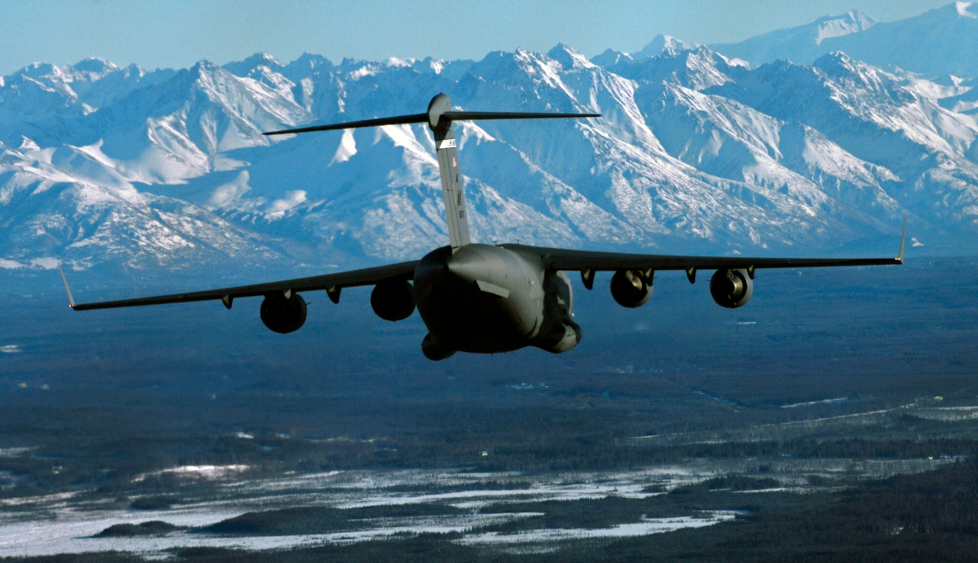 A C-17 Globemaster III from the 517th Airlift Squadron prepares to drop Soldiers from the 6th Engineer Battalion (Combat) (Airborne) over Malemute Drop Zone, Feb. 7. (U.S. Air Force photo/Tech Sgt. Brian Ferguson)