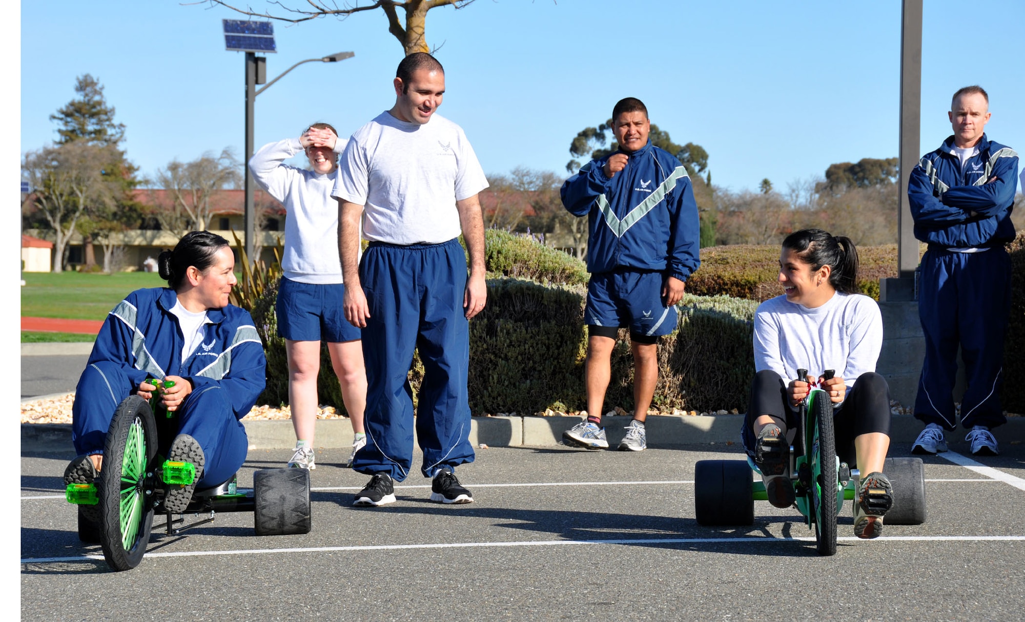 TRAVIS AIR FORCE BASE, Calif. -- Members of the 349th Air Mobility Wing Wing Staff participated in team building event during the A flight Unit Training Assembly on February 12, 2012. The members ran a 3-legged race and relay run, participated in a hula hoop challenge, competed in a softball throw, and raced in a Huffy Green Monster Tri Wheel. (U.S. Air Force photo by Tech Sgt. Rachael Martinez)