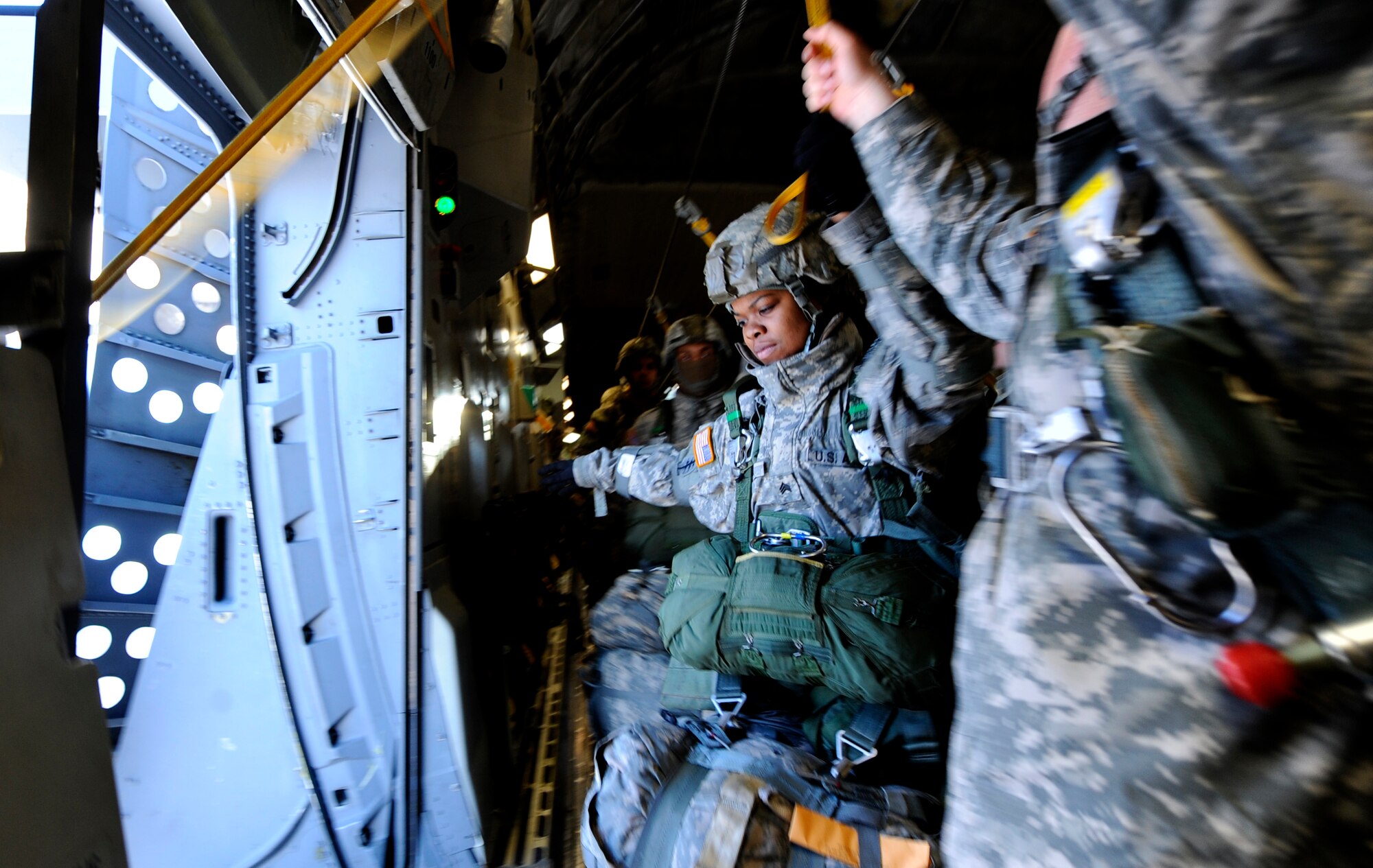 Sergeant Samantha Owens, 6th Engineer Battalion (Combat) (Airborne), prepares to jump from a C-17 Globemaster III from the 517th Airlift Squadron over Malemute Drop Zone, Feb.7. (U.S. Air Force photo/Tech Sgt. Brian Ferguson)