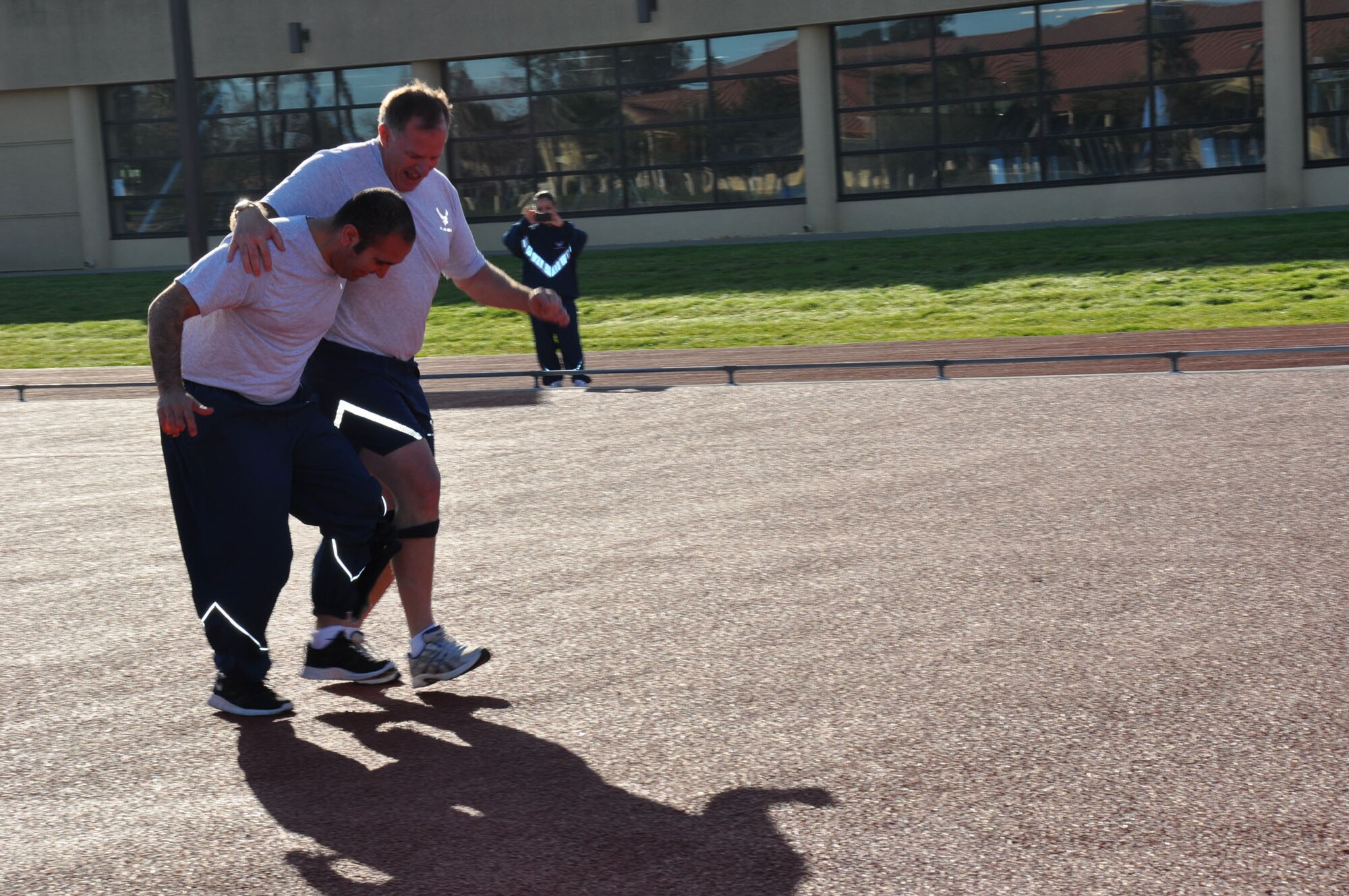 TRAVIS AIR FORCE BASE, Calif. -- Members of the 349th Air Mobility Wing Wing Staff participated in team building event during the A flight Unit Training Assembly on February 12, 2012. The members ran a 3-legged race and relay run, participated in a hula hoop challenge, competed in a softball throw, and raced in a Huffy Green Monster Tri Wheel. (U.S. Air Force photo by Tech Sgt. Rachael Martinez)