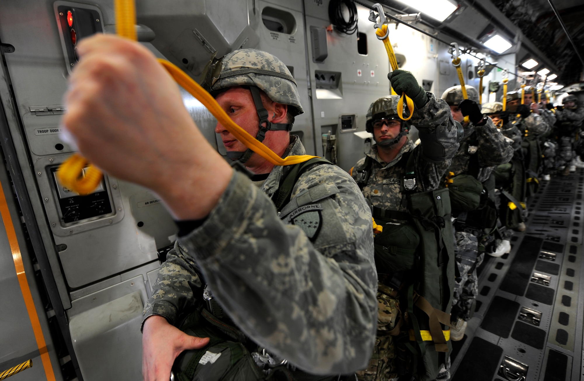 Soldiers from the 6th Engineer Battalion (Combat) (Airborne) prepare to jump from a C-17 Globemaster III from the 517th Airlift Squadron over Malemute Drop Zone, Feb.7. (U.S. Air Force photo/Tech Sgt. Brian Ferguson)
