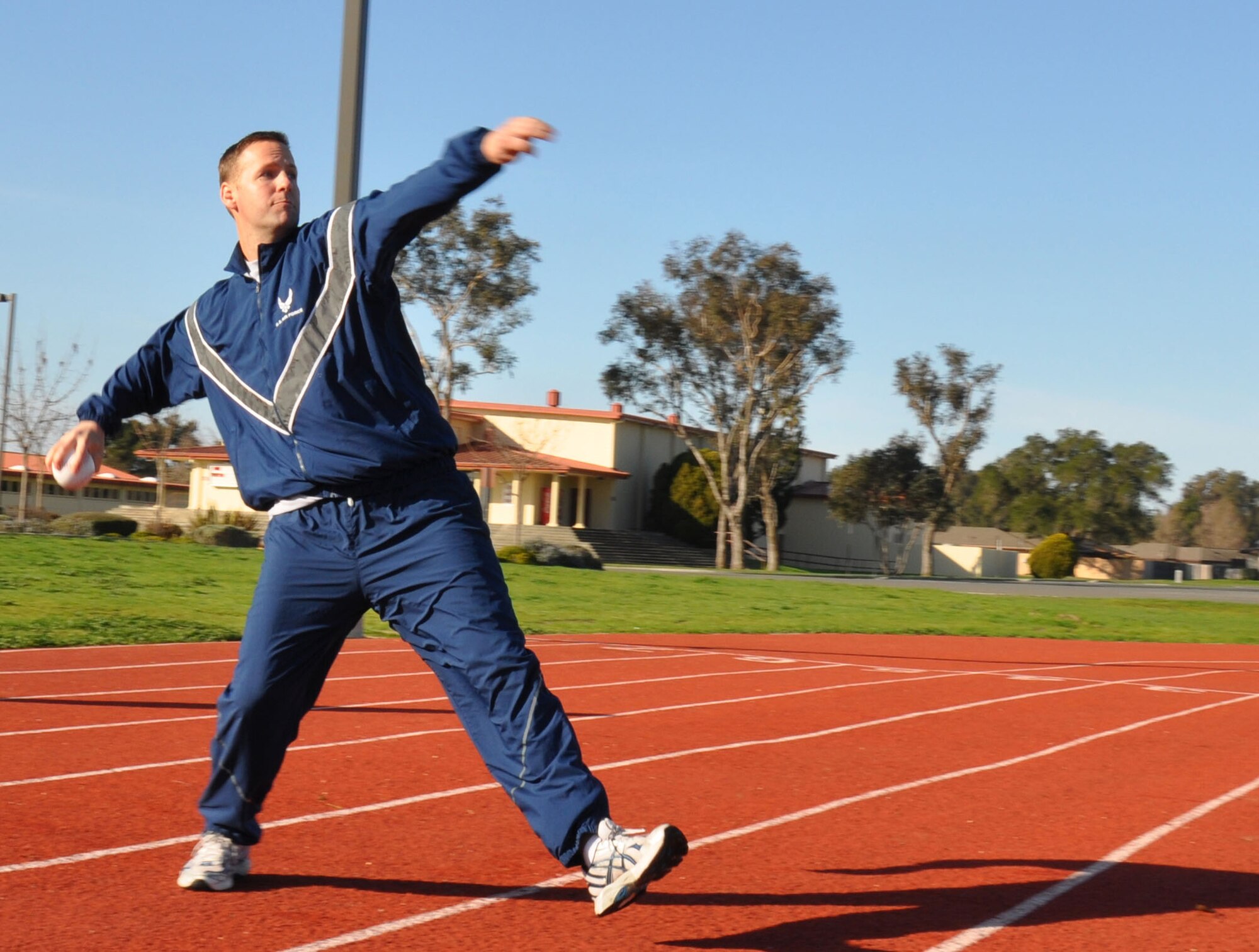 TRAVIS AIR FORCE BASE, Calif. -- Members of the 349th Air Mobility Wing Wing Staff participated in team building event during the A flight Unit Training Assembly on February 12, 2012. The members ran a 3-legged race and relay run, participated in a hula hoop challenge, competed in a softball throw, and raced in a Huffy Green Monster Tri Wheel. (U.S. Air Force photo by Tech Sgt. Rachael Martinez)