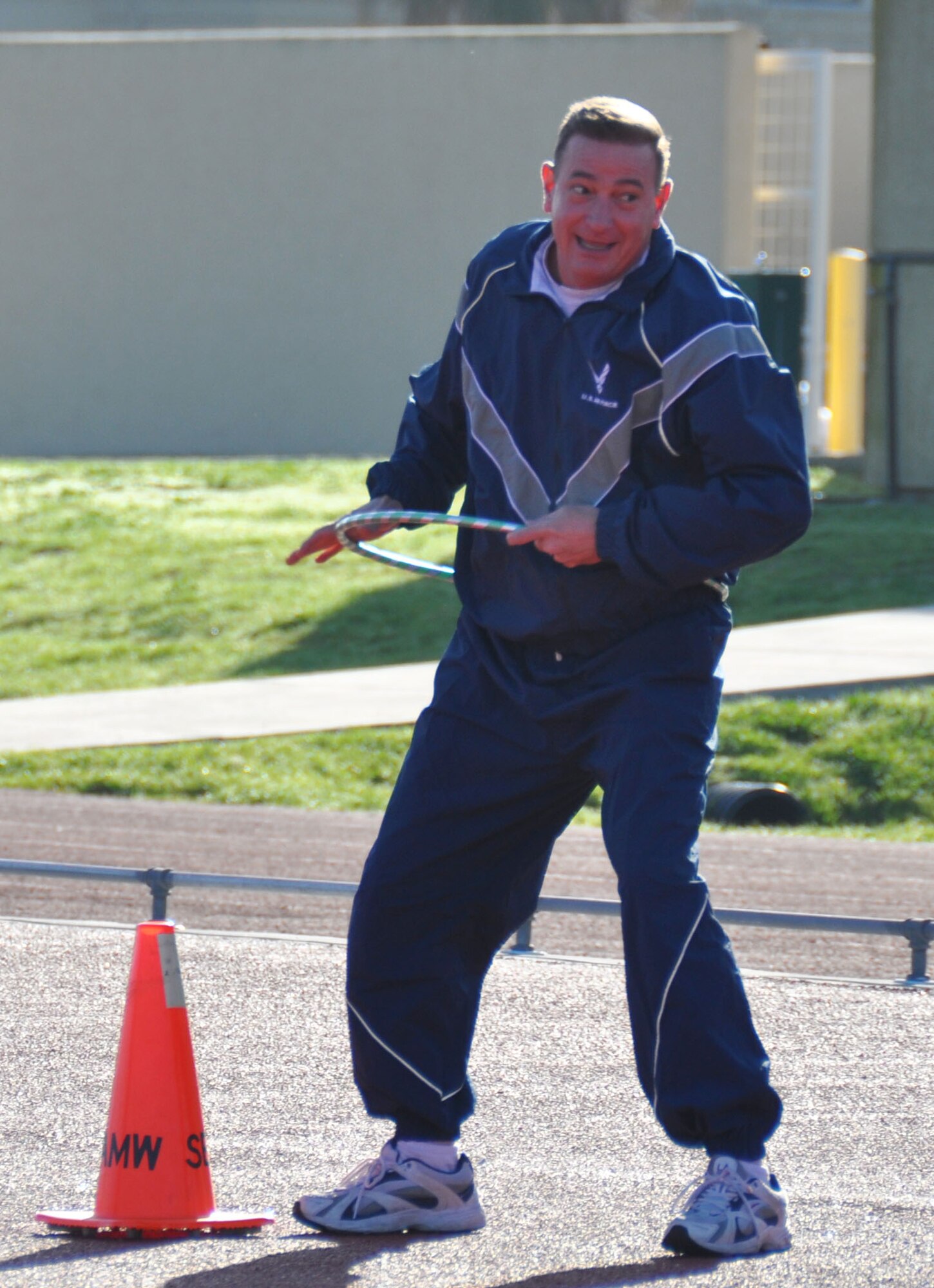 TRAVIS AIR FORCE BASE, Calif. -- Members of the 349th Air Mobility Wing Wing Staff participated in team building event during the A flight Unit Training Assembly on February 12, 2012. The members ran a 3-legged race and relay run, participated in a hula hoop challenge, competed in a softball throw, and raced in a Huffy Green Monster Tri Wheel. (U.S. Air Force photo by Tech Sgt. Rachael Martinez)