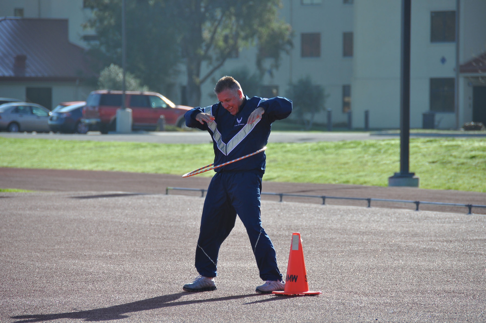 TRAVIS AIR FORCE BASE, Calif. -- Members of the 349th Air Mobility Wing Wing Staff participated in team building event during the A flight Unit Training Assembly on February 12, 2012. The members ran a 3-legged race and relay run, participated in a hula hoop challenge, competed in a softball throw, and raced in a Huffy Green Monster Tri Wheel. (U.S. Air Force photo by Tech Sgt. Rachael Martinez)