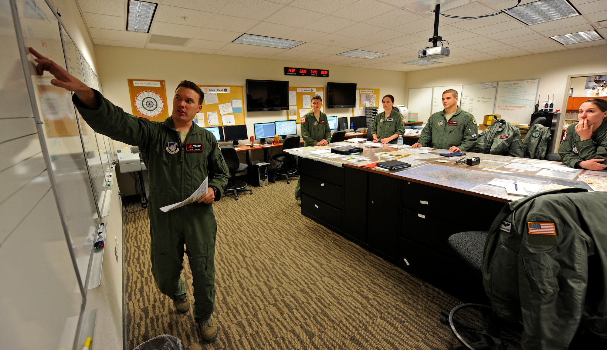 Capt. Zach Coburn briefs the crew before executing a heavy equipment and personnel air drop, Feb. 7. Coburn is a C-17 Globemaster III pilot with the 517th Airlift Squadron, Joint Base Elmendorf-Richardson, Alaska. (U.S. Air Force photo/Tech Sgt. Brian Ferguson)