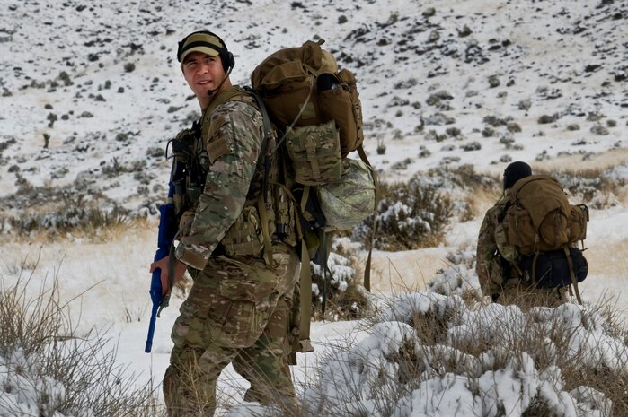 U.S. Air Force pararescuemen, 58th Rescue Squadron, move toward the location of a simulated casualty during survive, evade, resist, escape initial familiarization training Feb. 14, 2012, near Alamo, Nev. Pararescuemen are required to attend the SERE IFAM, focusing on their navigation skills, as a part of their mission qualification training. (U.S. Air Force photo by Airman 1st Class Daniel Hughes)