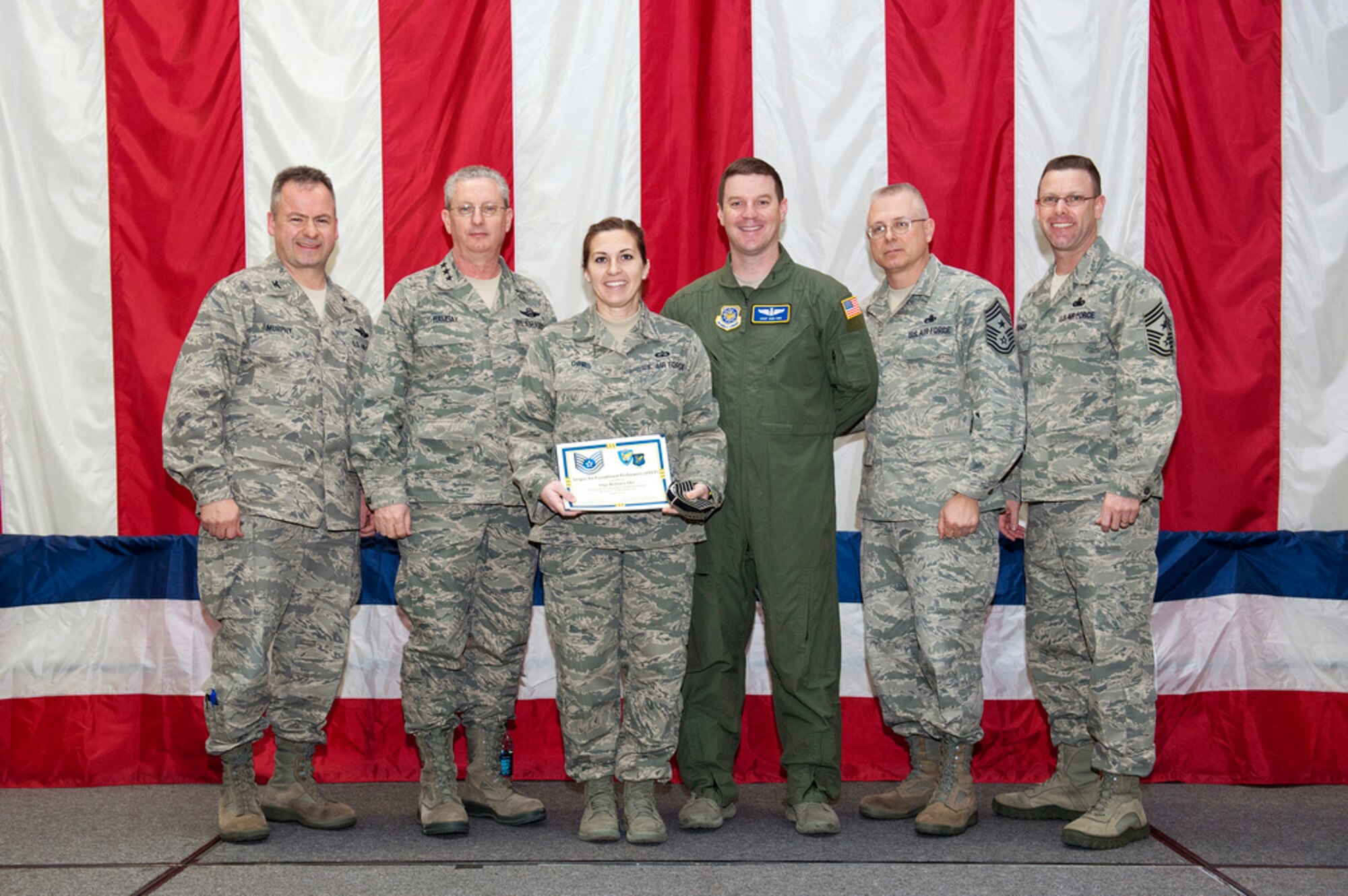 Staff Sgt. Brittney Orr, 305th Operations Support Squadron NCO in charge of air traffic control standardization and evaluation, was STEP promoted to the rank of technical sergeant by Lt. Gen. Mark Ramsay, 18th Air Force commander, Feb. 15 during an all-call at the Joint Base Theatre. Orr was STEP promoted, which stands for Stripes for Exceptional Performers, for her volunteerism, consistent award winning and for filling an E-7 position, in which she supervised 50 Airmen during her deployment to Balad, Iraq. (U.S. Air Force photo by Russell Meseroll/Released)
