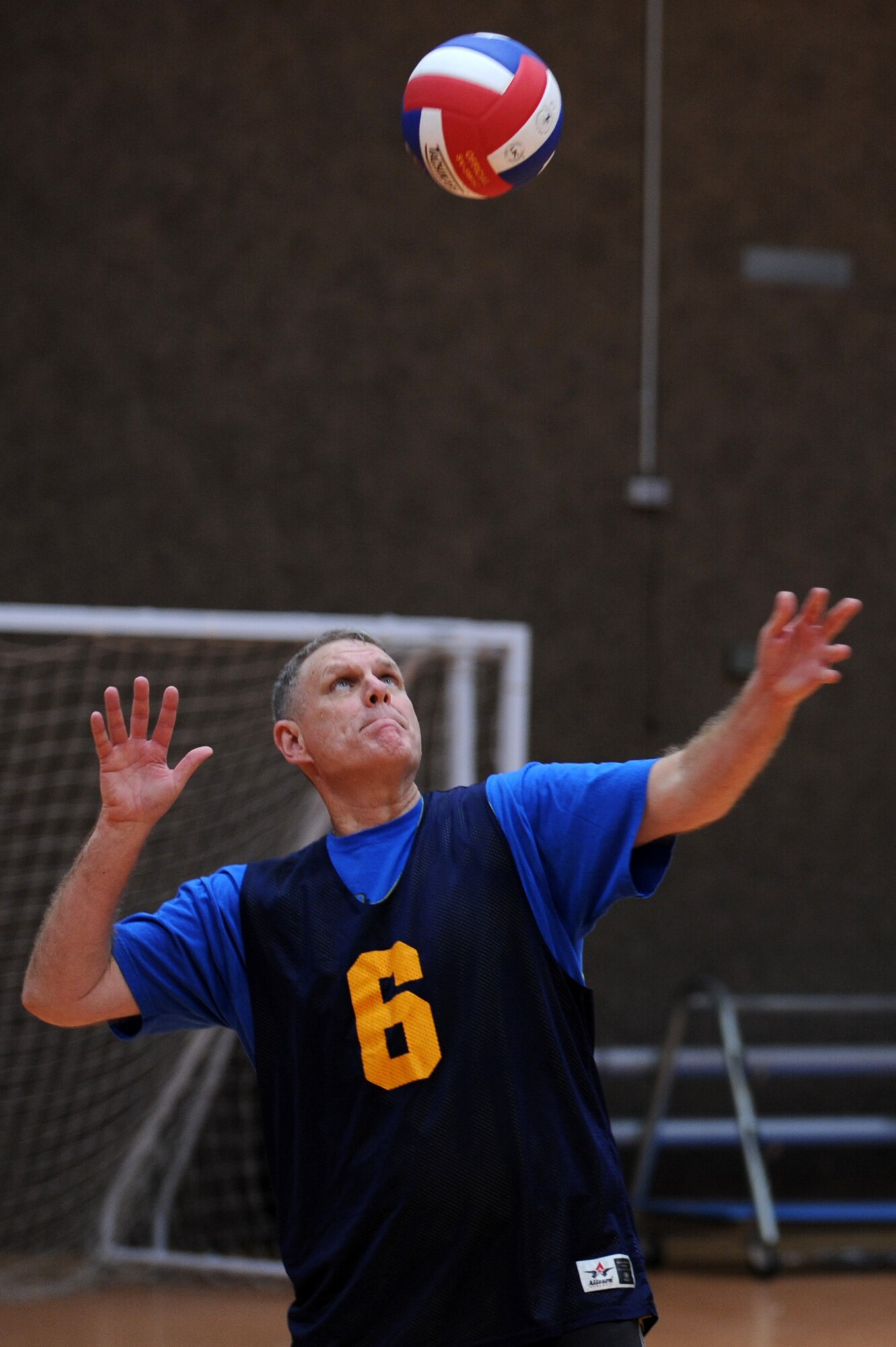 SPANGDAHLEM AIR BASE, Germany – Dennis Wilson, 606th Air Control Squadron, serves the volleyball during an intramural volleyball game against the 606th Air Control Squadron at the Skelton Memorial Fitness Center here Feb. 15. FSS defeated ACS in two sets, 25-16 and 26-24.  This match kicked off the intramural volleyball season, and games will be played Monday – Thursday beginning at 6:30 p.m. at the fitness center. (U.S. Air Force photo by Airman 1st Class Matthew B. Fredericks/Released)