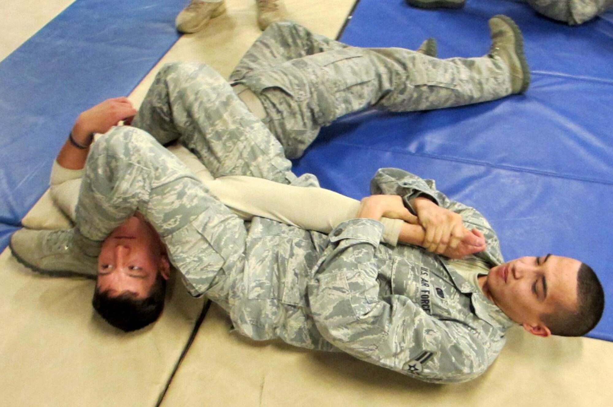 Airman 1st Class Richard Dominguez and Airman Samuel Kirschbaum, both from the 721st Security Forces Squadron, practice combatives Jan. 24 at Cheyenne Mountain Air Force Station. The training was aimed at improving security forces skills. (U.S. Air Force photo/Tech. Sgt. Brianne Van Horn)