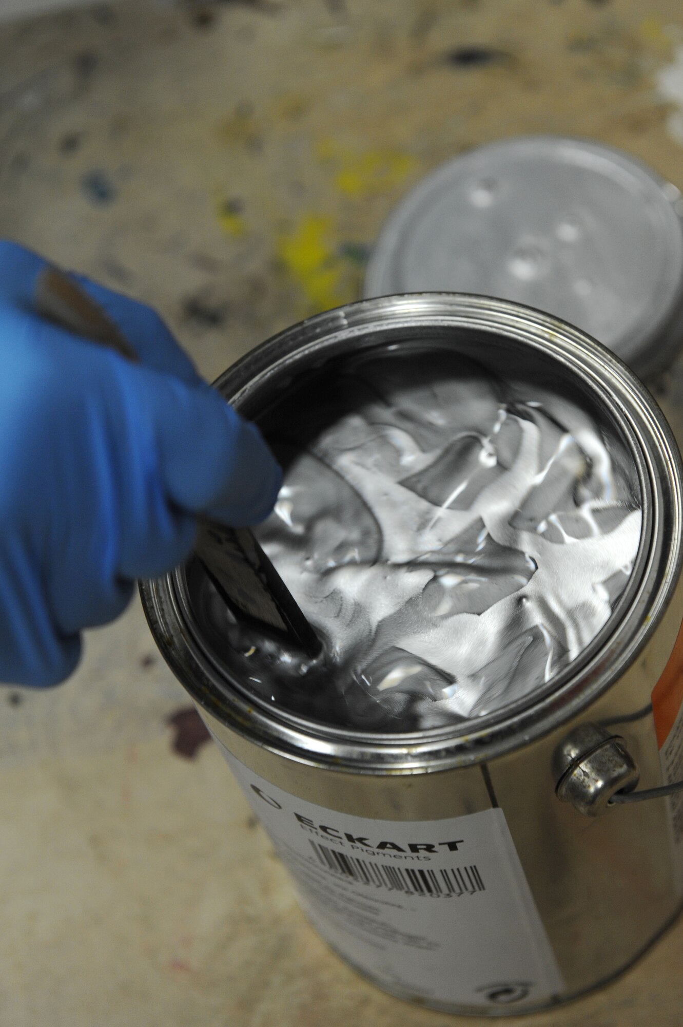 SPANGDAHLEM AIR BASE, Germany – Achim Elsen, 52nd Civil Engineer Squadron painter, mixes paint in the paint shop at Bldg. 120 here Feb 14. Elsen, along with seven other painters, maintains paint for the flightline, road markings, traffic signs, parking lots, government buildings, signs and other items needed for base special events. Painting visible and up-to-date signs and road markings helps the base stay safe. This makes road markings visible from a further distance keeping traffic flow orderly and safe. (U.S. Air Force photo by Senior Airman Christopher Toon/Released)