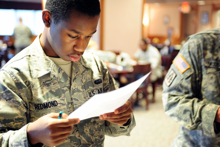 U.S. Air Force Airman 1st Class David Redmond rates food on a scale of one to five during a Food Demo at the Southern Eagle Dining Facility on Seymour Johnson Air Force Base, N.C., Feb. 16, 2012. The staff used the demonstration to revamp the menu to increase customer satisfaction. Redmond, 4th Communication Squadron network operations specialist, hails from Macon, Ga.(U.S. Air Force photo/Airman 1st Class Mariah Tolbert/Released)
