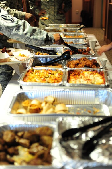 Airmen and base personnel sample a buffet line of new foods at the Southern Eagle Dining Facility on Seymour Johnson Air Force Base, N.C., Feb. 16, 2012. The dining facility manager will review surveys completed by patrons who sampled potential menu items to revamp their selections. (U.S. Air Force photo/Airman 1st Class Mariah Tolbert/Released)