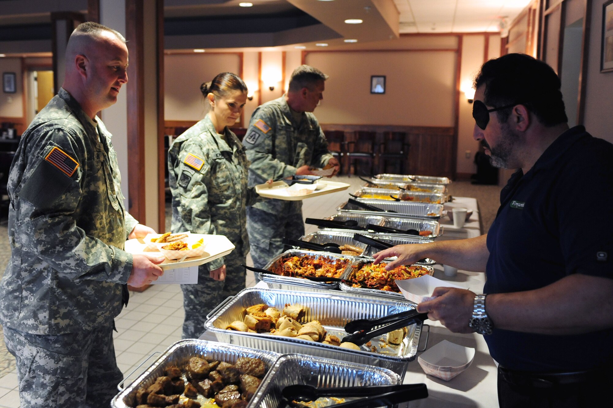 U.S.  Army personnel choose foods to sample at the Southern Eagle Dining Facility on Seymour Johnson Air Force Base, N.C., Feb. 16, 2012. The sampling showcased foods from companies like Fontanini and Corporate Chefs. The soldiers are assigned to the 30th Brigade Combat Team in Clinton, N.C.  (U.S. Air Force photo/Airman 1st Class Mariah Tolbert/Released)