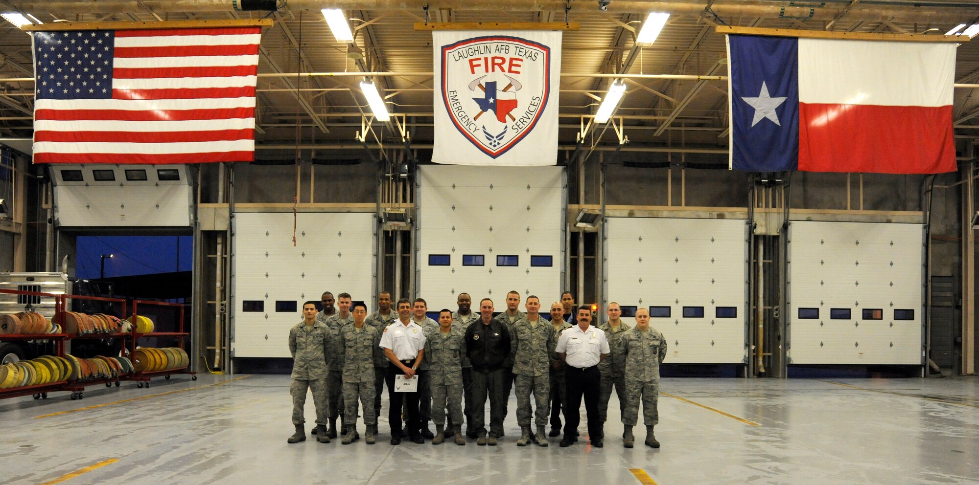 LAUGHLIN AIR FORCE BASE, Texas – Laughlin's hazardous material response team, comprised of Airmen from the 47th Civil Engineer Squadron and 47th Medical Operations Squadron, pose with Col. Tom Murphy, 47th Flying Training Wing commander, and Chief Master Sgt. Ray DeVite, 47th FTW command chief, after being presented the XLer of the week award here Feb. 15. The XLer is a weekly award chosen by wing leadership and given to those who consistently make outstanding contributions to Laughlin and their unit. (U.S. Air Force photo/Airman 1st Class Nathan L. Maysonet)