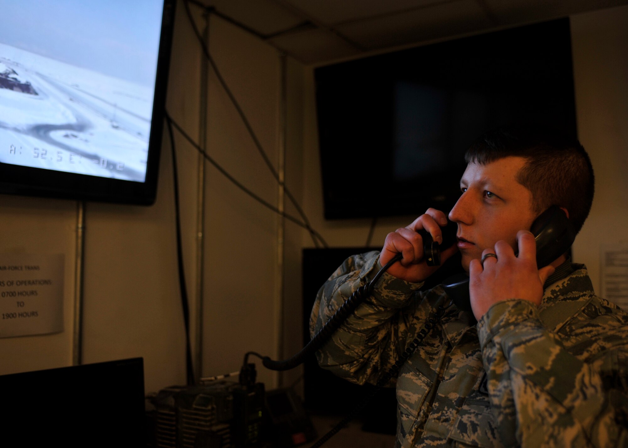 BAGRAM AIRFIELD, Afghanistan—Staff Sgt. Leonard Sherwood observes perimeter surveillance equipment at Bagram Airfield, Afghanistan, Feb. 16, 2012. Sherwood is a controller with the 455th Expeditionary Security Forces Squadron and is deployed from Beale Air Force Base, Calif. Controllers remotely monitor Bagram’s perimeter for potential threats and report all security violations to security forces, allowing them to take defensive action. (U.S. Air Force photo/Airman 1st Class Ericka Engblom)